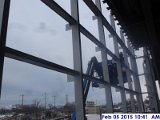 Installing weather strips along the curtain wall South Elevation.jpg